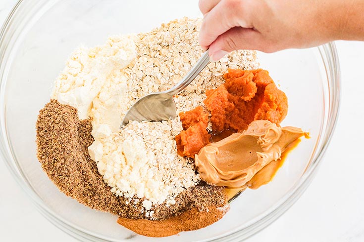 Mixing the base ingredients in a glass mixing bowl.