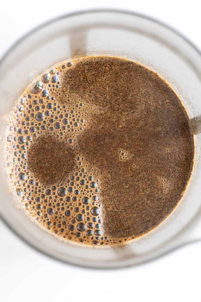 Water added to coffee grounds in a french press.