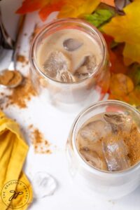 An overhead view of Pumpkin Iced Coffee in two cups with ice.