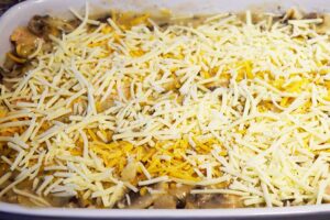 Grated cheese sprinkled over the top of the casserole.