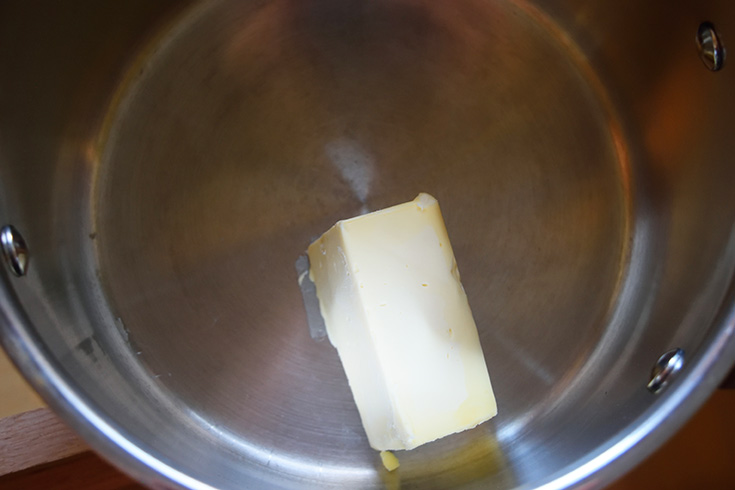 Melting butter in a pot.