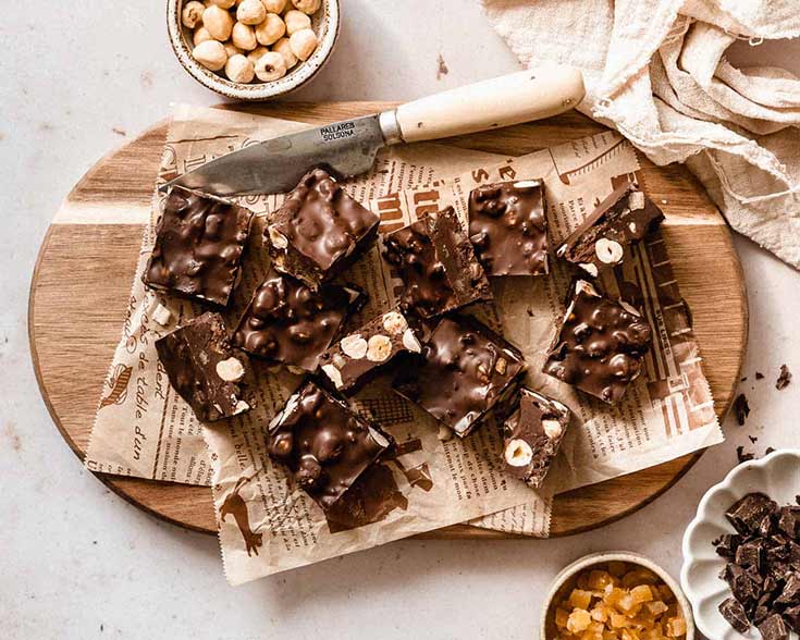 Squares of healthy rocky road on a cutting board.