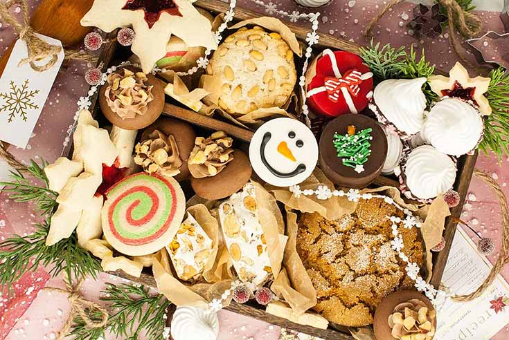 A box of assorted holiday cookies.