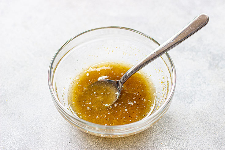 Butter sauce mixed together in a bowl for Lemon Salmon.