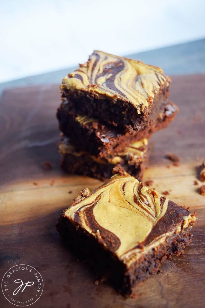 Peanut Butter Swirl Brownies on a cutting board.