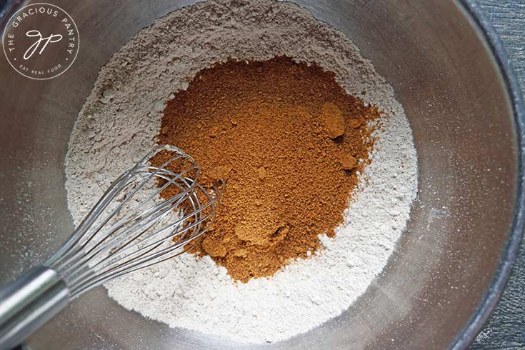 Pumpkin Blondies dry ingredients in a mixing bowl with a whisk.