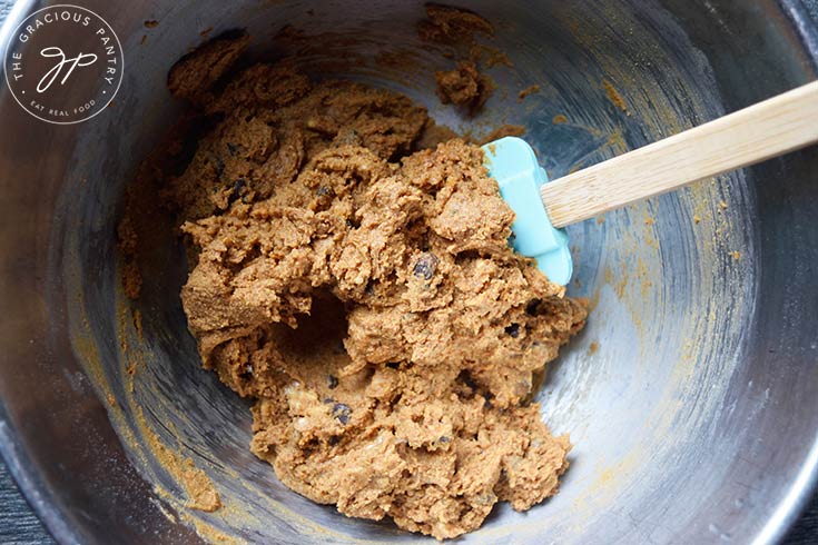 Mixed Pumpkin Blondies batter in a mixing bowl with a spatula.