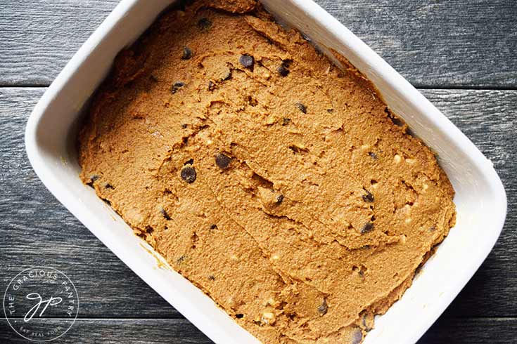 Raw Pumpkin Blondies batter in a baking pan.