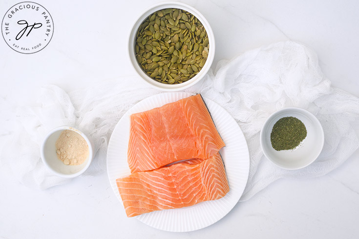 Ingredients for this recipe in individual bowls on a white surface.