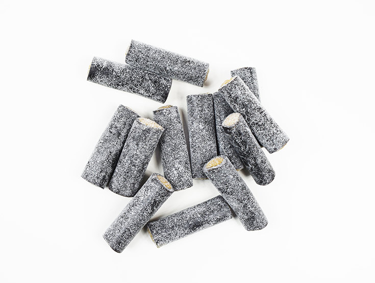 Salted licorice on a white background.