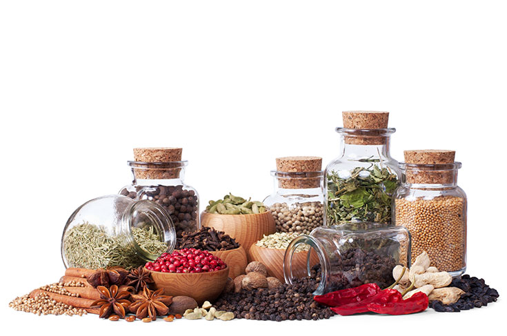 Dried herbs and spices in various jars.