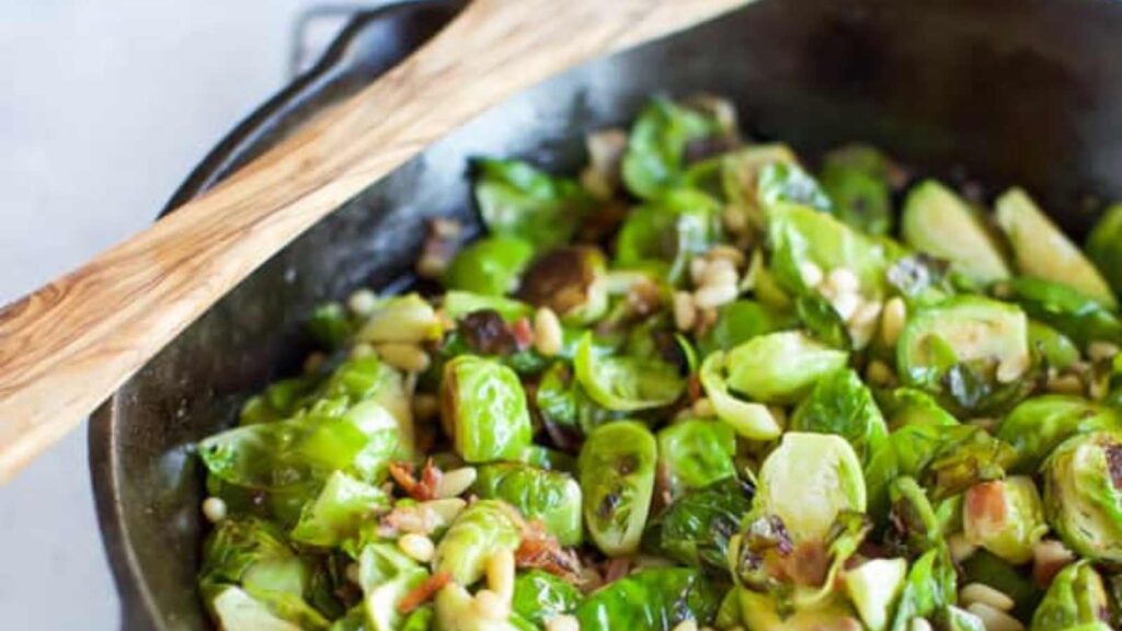 Sautéd Brussels Sprouts With Pancetta in a skillet.