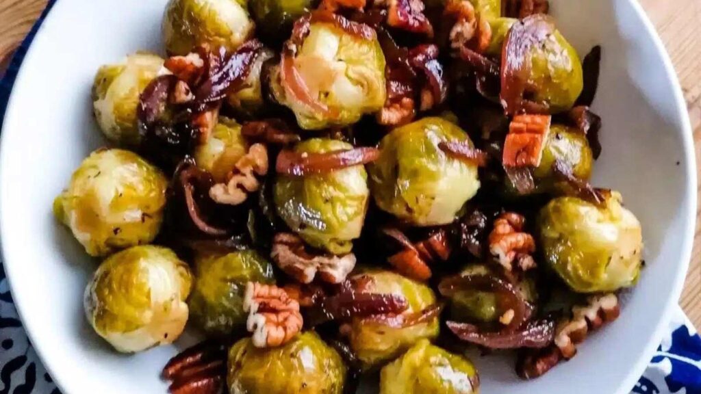 Roasted Brussels sprouts with honey balsamic vinegar in a white bowl.