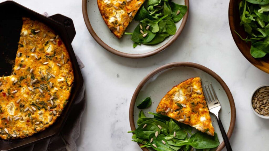 Slices of baked frittata on plates.