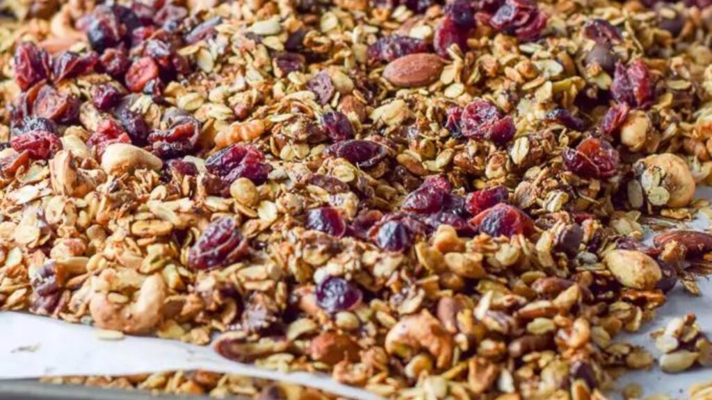 A sheet pan filled with cranberry chocolate granola.