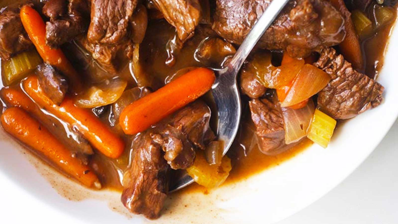 An overhead view looking down into a white bowl filled with this Bison Stew Recipe.