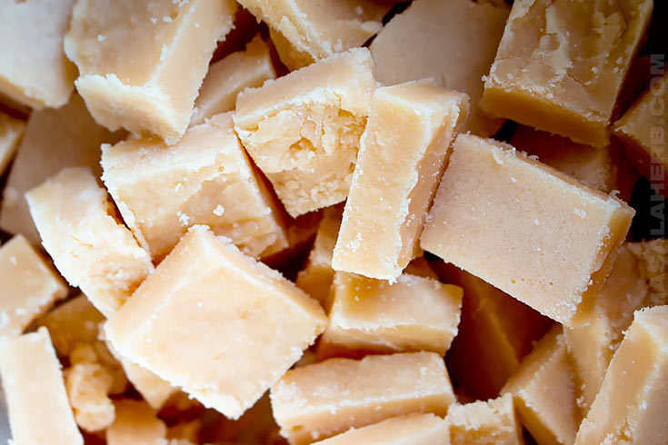 A closeup of a pile of caramel candy.