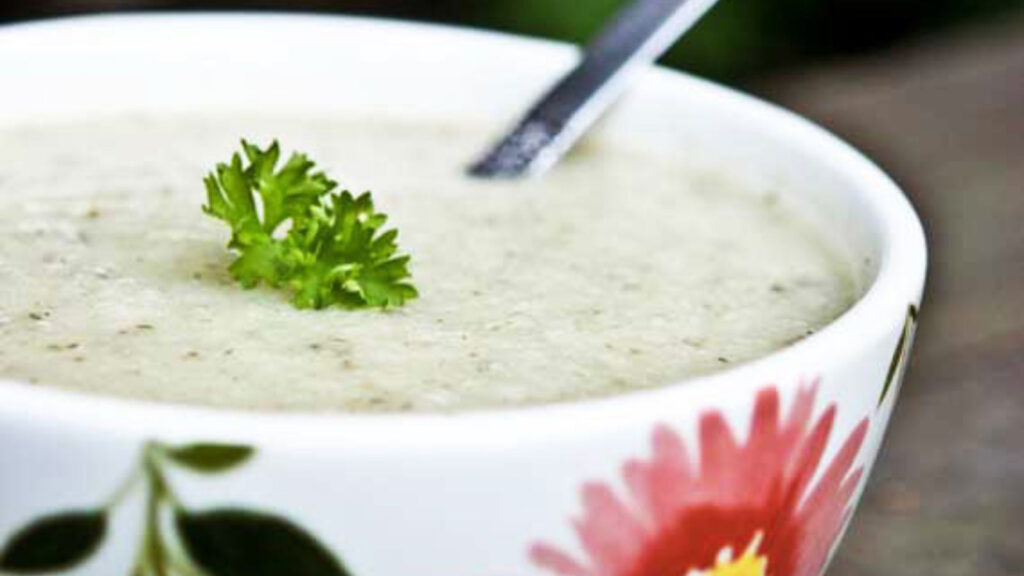 A closeup of a bowl of cauliflower soup.