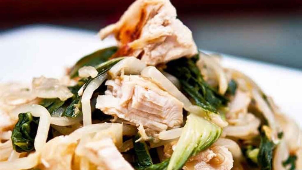 Chicken bok choy on a white plate.