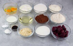 Chocolate Christmas Cake Recipe ingredients in individual bowls on a table.