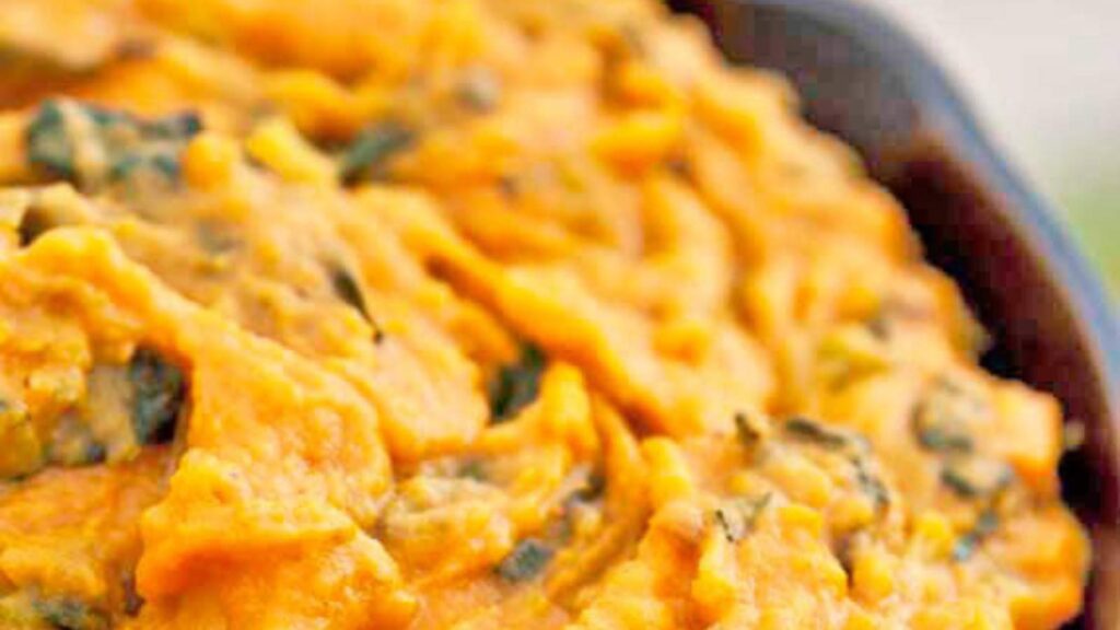 A closeup of Sweet Potato Irish Colcannon in a black skillet.