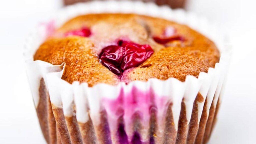 A closeup of a cranberry muffin.