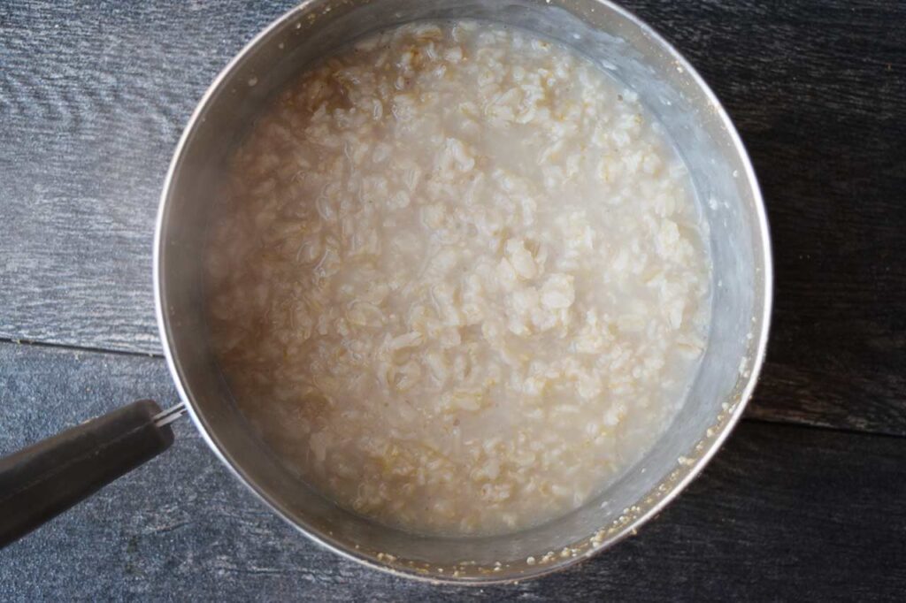 Cooked oatmeal in a pot.