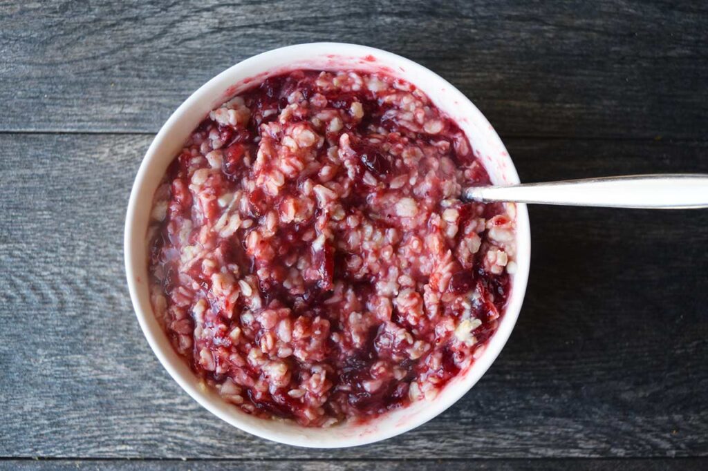 Cranberry sauce stirred into oatmeal.
