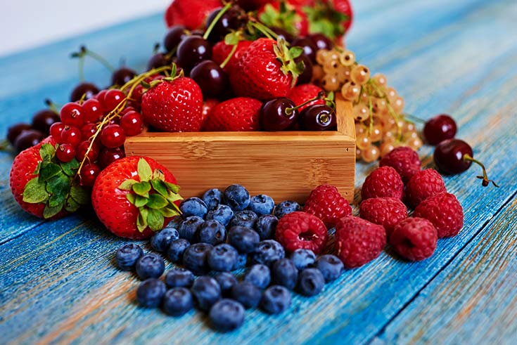 A collection of berries and cherries.