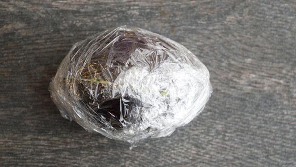Option three for freezing avocados is to remove the seed, put the halves back together, wrap in plastic wrap and place in the freezer.