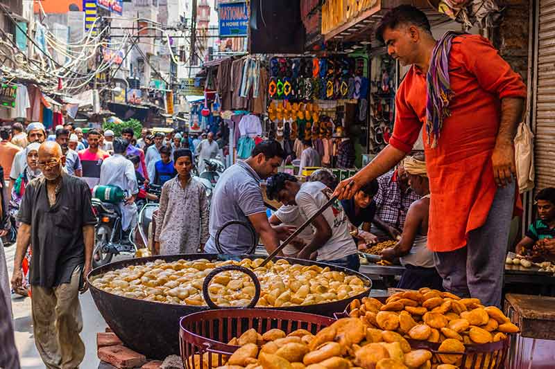 A street vender making food in India.