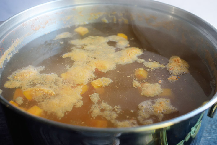 A pot of water and sweet potatoes.