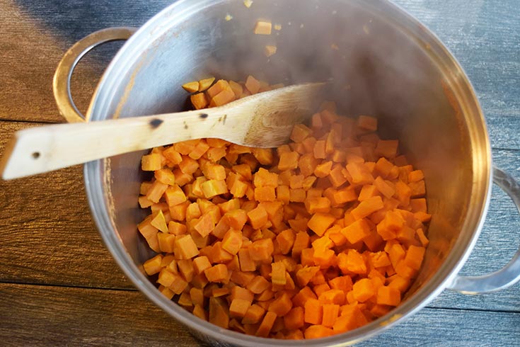 Sweet potato cubes returned to the pot they were boiled in.