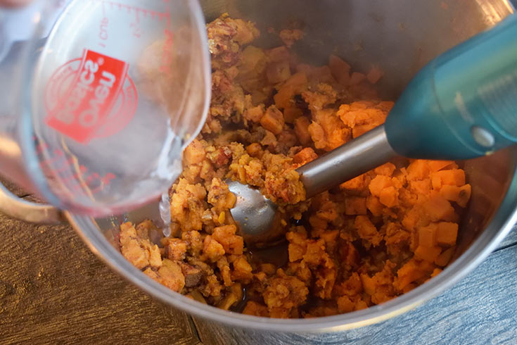Adding a cup of broth to the sweet potatoes for a smoother texture.