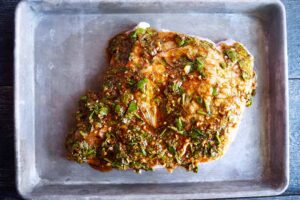 Remaining herb mix spread over the top of the entire chicken breast.