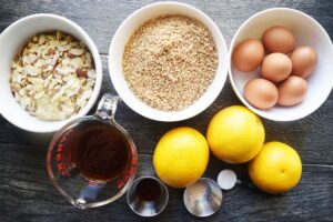 Ingredients for this Orange Almond Cake Recipe in individual bowls and containers.