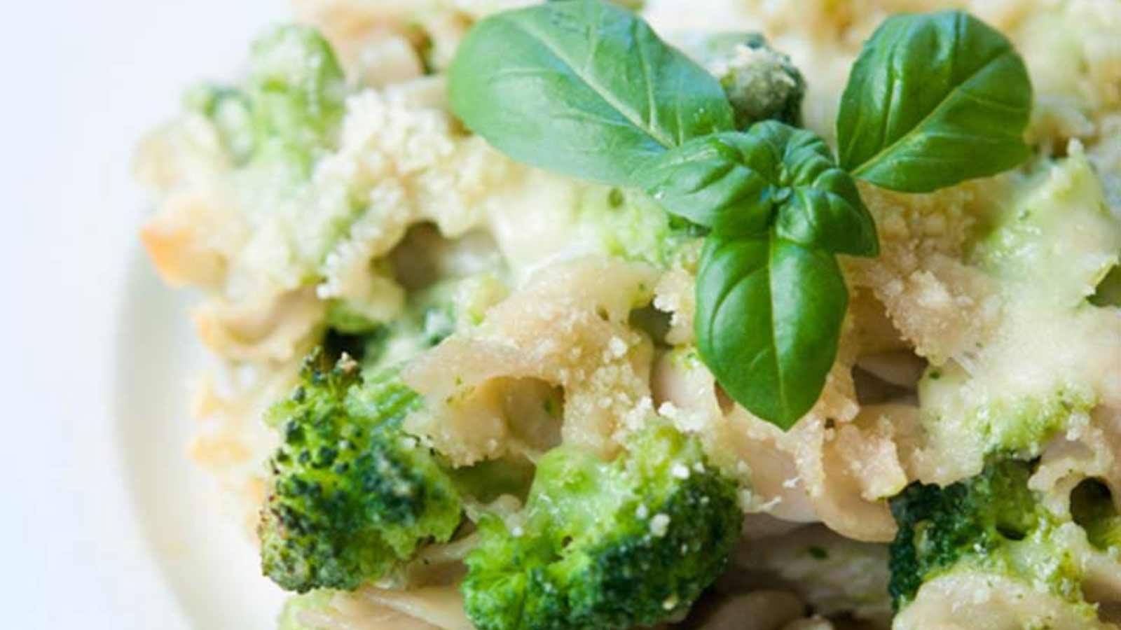 A white plate holding a serving of Pesto Pasta Bake.