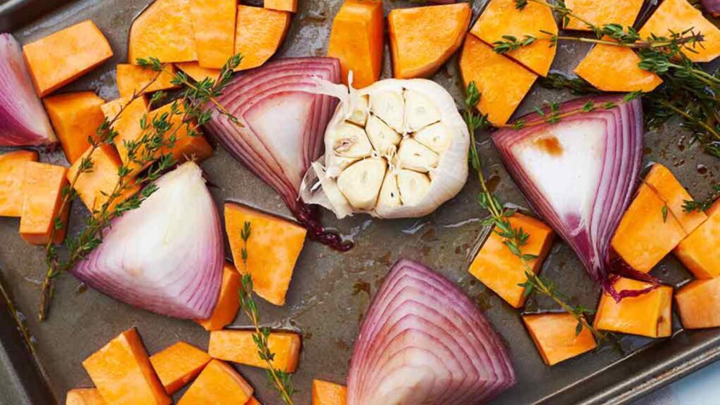 A sheet pan filled with ingredients for making this Roasted Sweet Potato Salad Recipe.