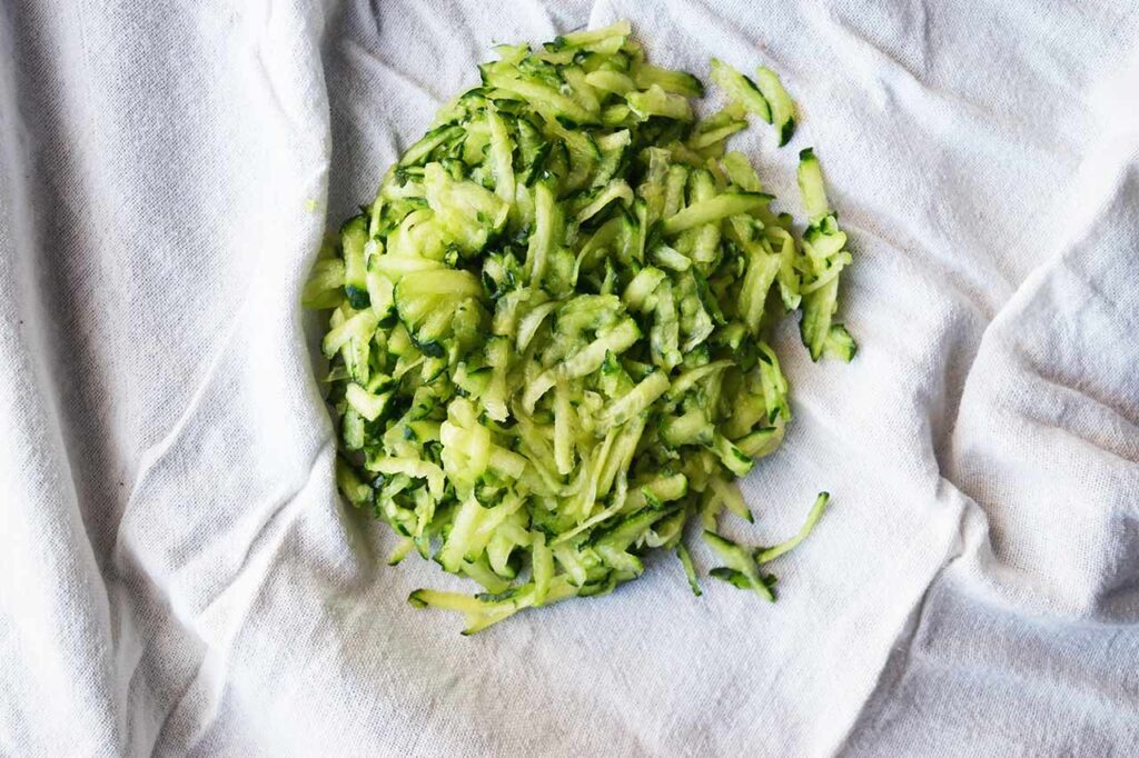 Grated cucumber in a tea towel.