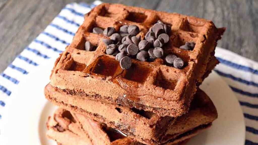 Looking down onto this stack of Vegan Chocolate Waffles topped with vegan chocolate chips.