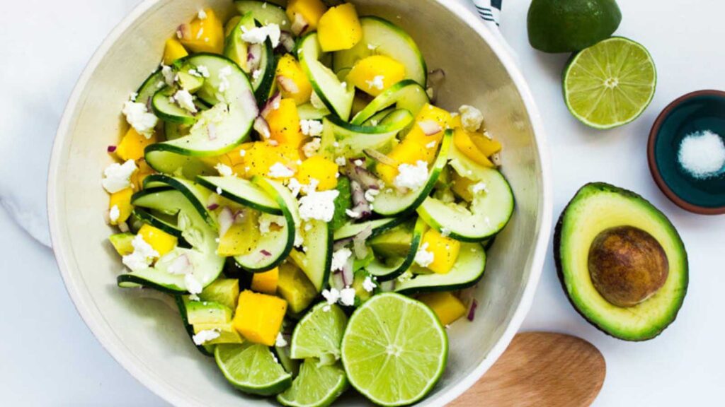 A bowl filled with spiralized cucumber summer salad.