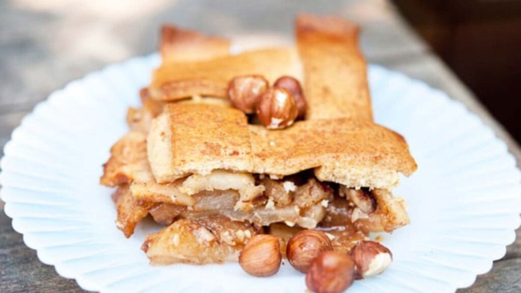 A slice of Apple Hazelnut Cobbler on a white plate.