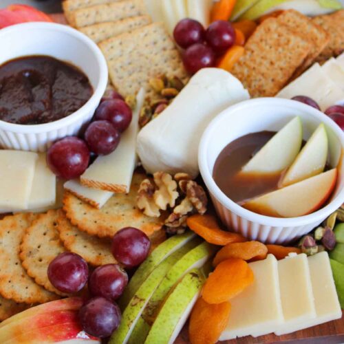 A closeup of a fruit and cheese charcuterie board.