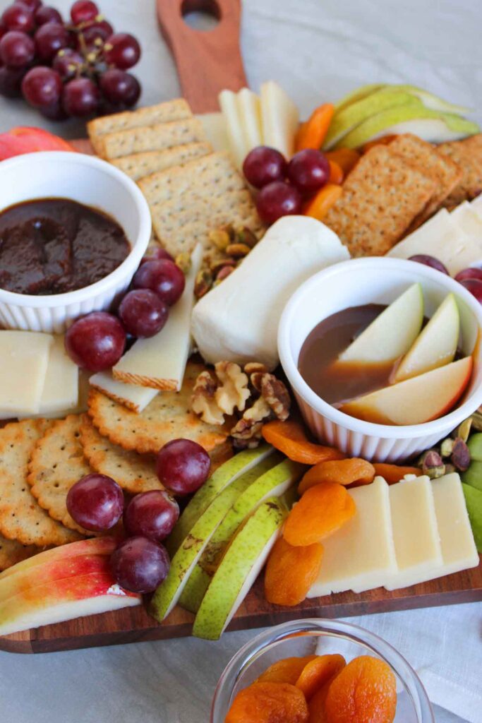 A closeup of a fruit and cheese charcuterie board.