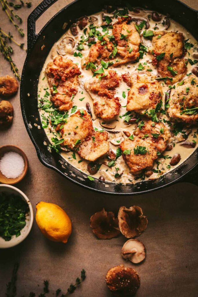 Champagne chicken in a cast iron pot.