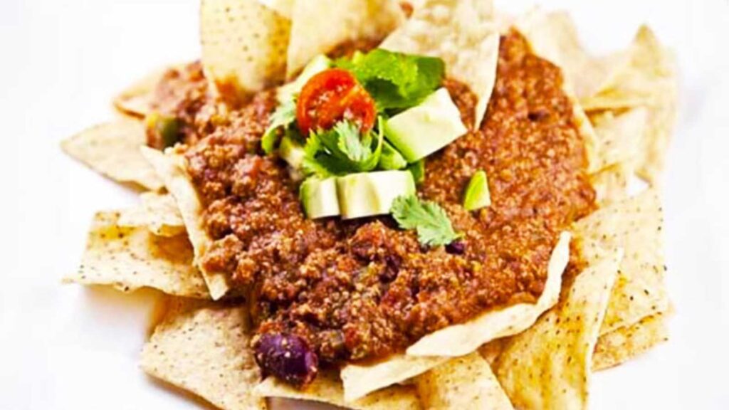 Chili nachos on a white background.