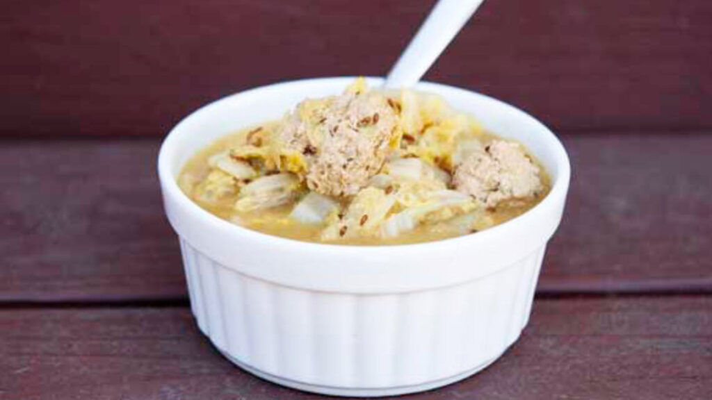 The finished German Cabbage Soup Recipe served in a white bowl.