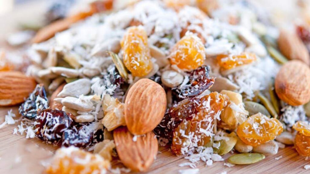 A closeup of a pile of Grain Free Trail Mix on a cutting board.