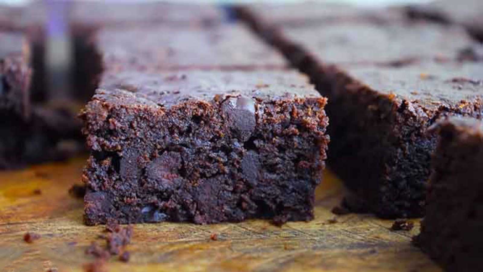 Cut brownies on a wood cutting board.