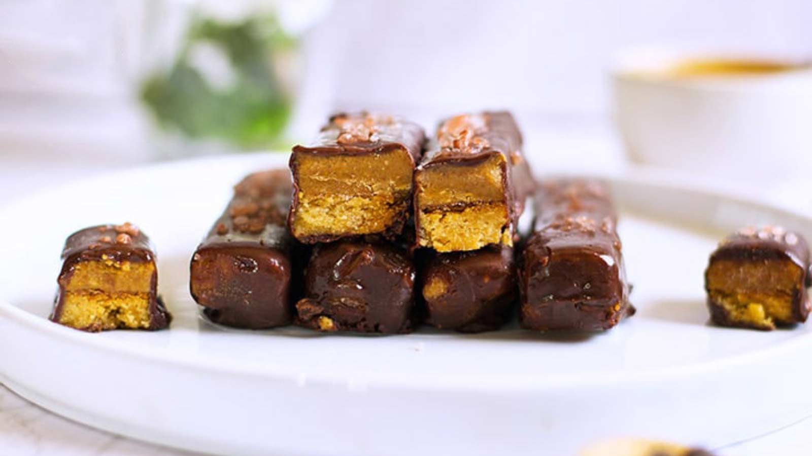 A side view of Healthy Twix Bars on a white plate.